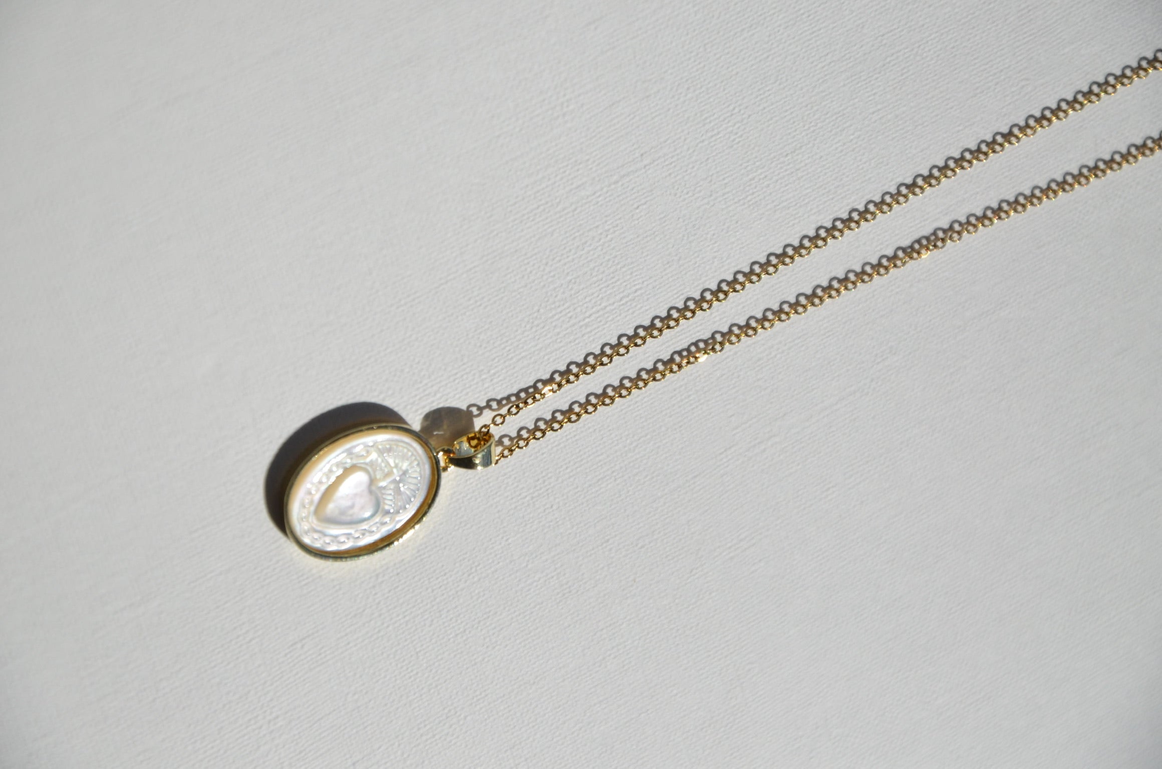 Ta médaille cœur de nacre