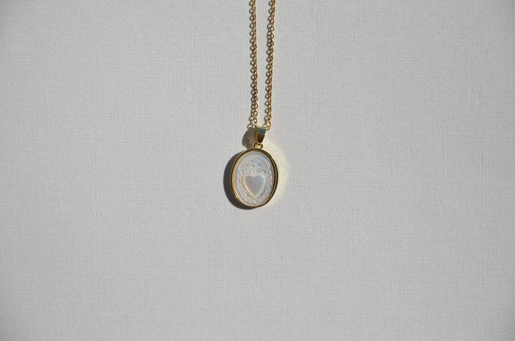Ta médaille cœur de nacre