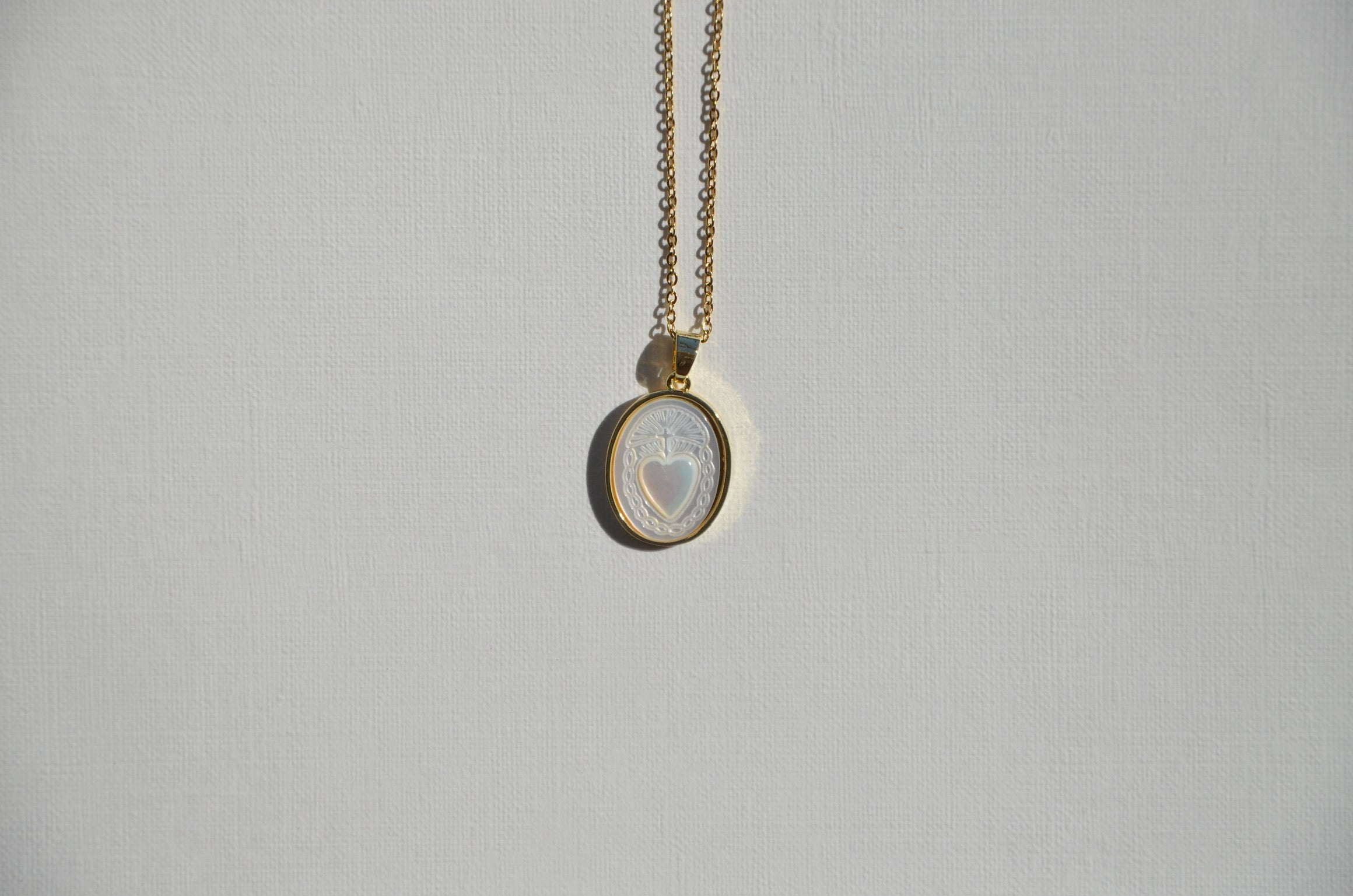 Ta médaille cœur de nacre